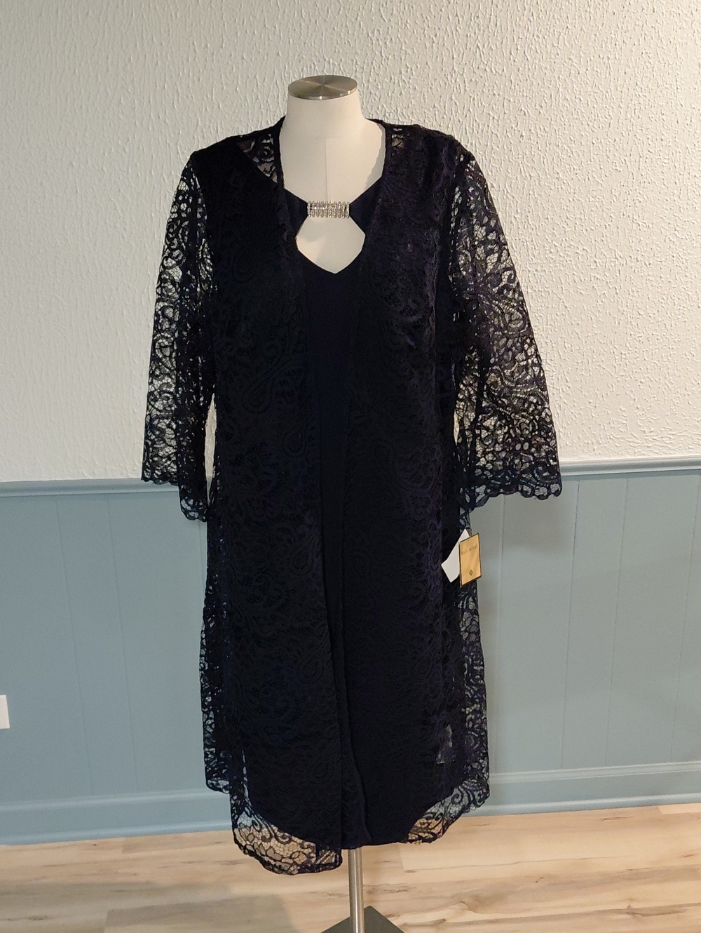 Elegant Navy Lace Overlay Dress with Decorative Neck Accent